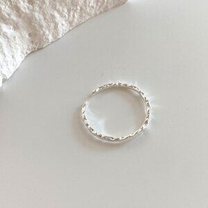 Small and exquisite sterling silver open ring with irregular hammered texture